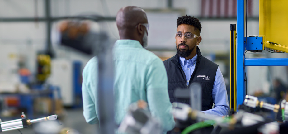Consumers energy worker going over business rebates and discounts